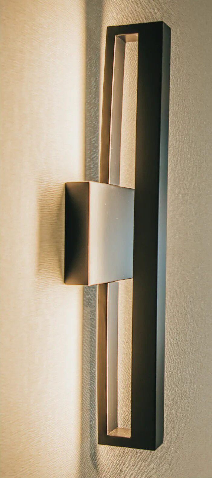 Close-up of a framed custom corridor sconce