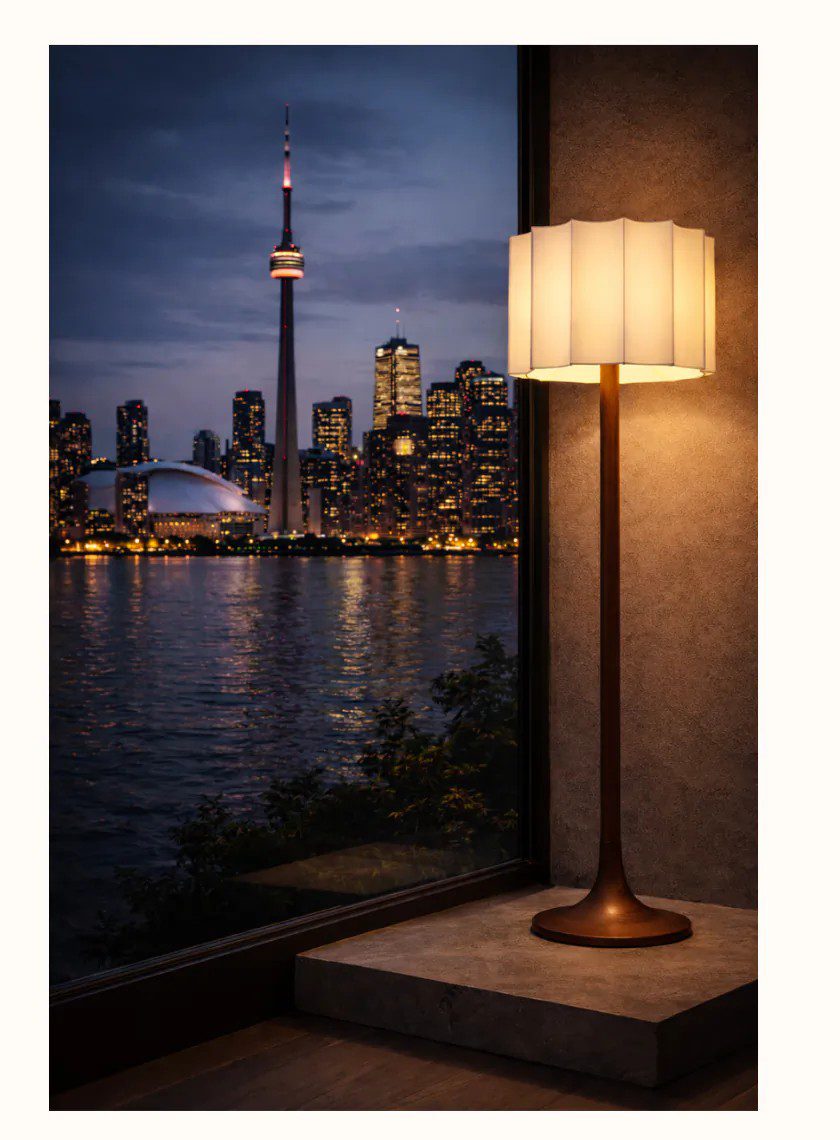 Floor lamp beside a Toronto skyline view