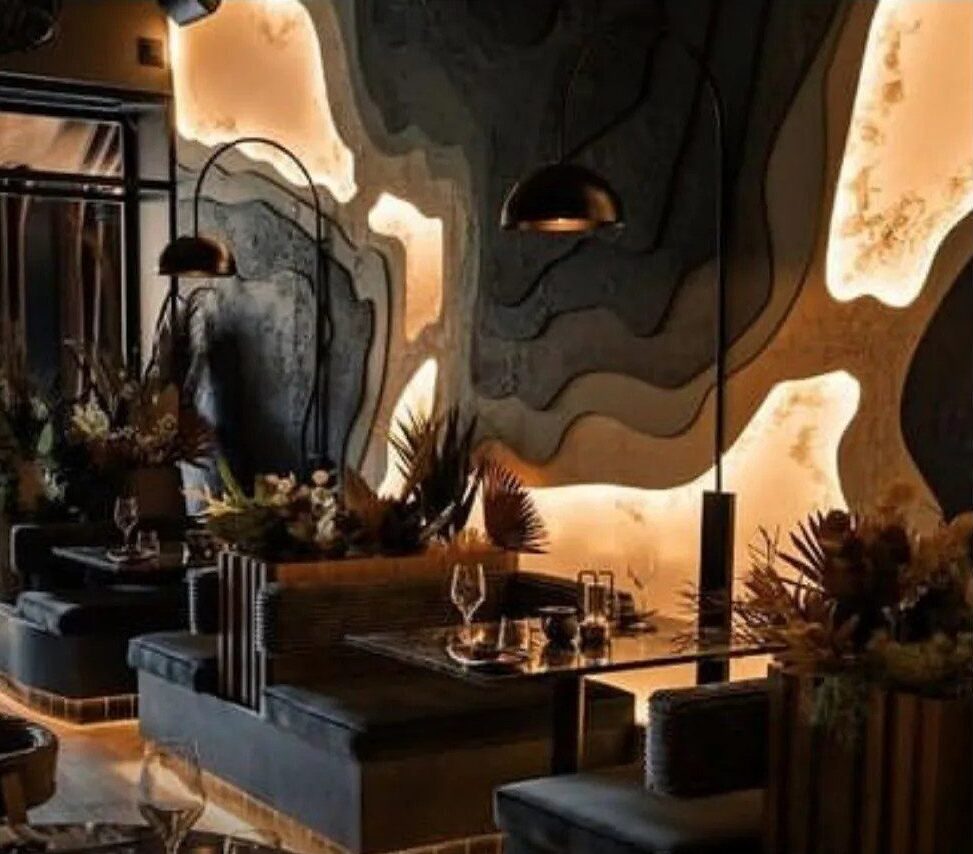Lounge with sculptural backlit wall